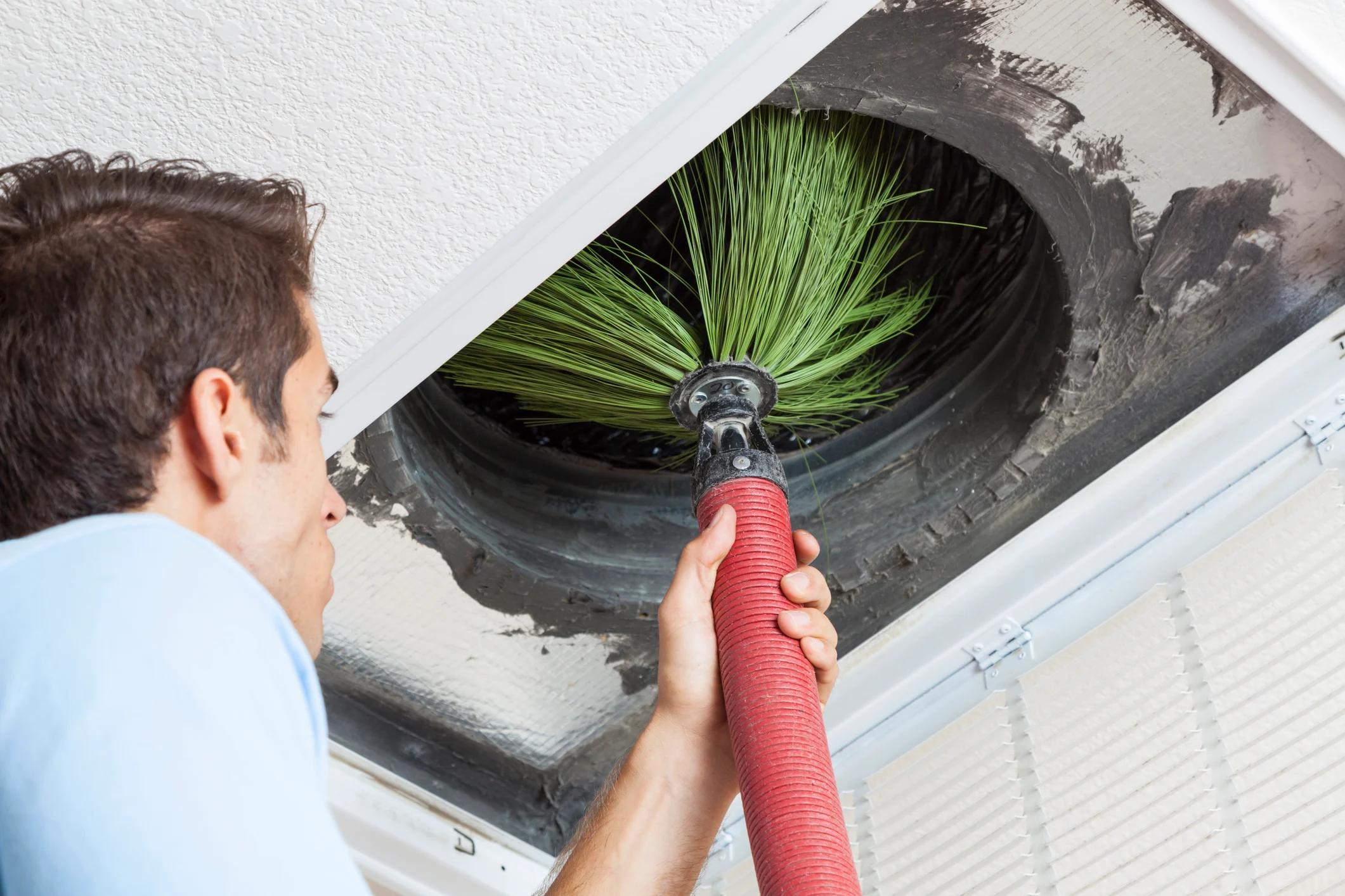 HVAC duct cleaning service removing construction dust from ventilation systems in Dallas